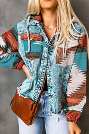 Denim hoodie jacket with Southwestern print in blue, white, orange, and brown, featuring frayed hem.