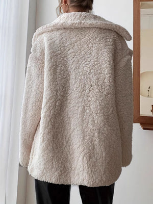 Cream teddy bear shawl collar jacket with buttoned front and cozy texture.