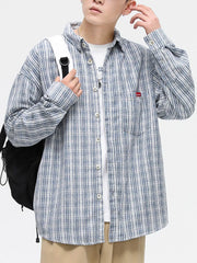 Men's light blue plaid button-up shirt with chest pocket