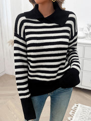 Black and white stripe knit pullover sweater with wide collar and ribbed cuffs.