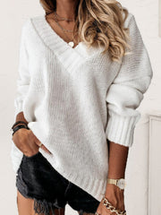 White ribbed trim V-neck knit sweater with long sleeves.