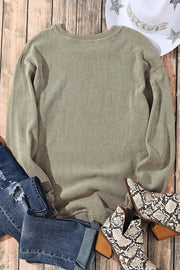 Sage ribbed knit sweater with crew neck and long sleeves.