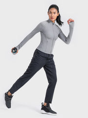 Heather gray ribbed performance zip-up jacket with thumbholes and mock neck.