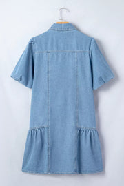 Light blue denim dress with puff sleeves, ruffled hem, and button front detail.