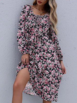 Black floral midi dress with long sleeves, square neckline, and thigh-high slit.