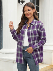 Purple plaid button-up shirt with two chest pockets and long sleeves.