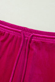 Velvet culotte pants in Deep Rose with elastic waistband and drawstring.