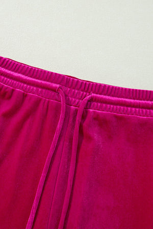 Velvet culotte pants in Deep Rose with elastic waistband and drawstring.