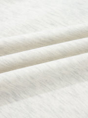 Heathered casual top in light grey cotton with button detail, showing fabric texture.