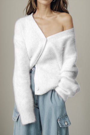 White fluffy angora V-neck cardigan with button detail and relaxed fit.