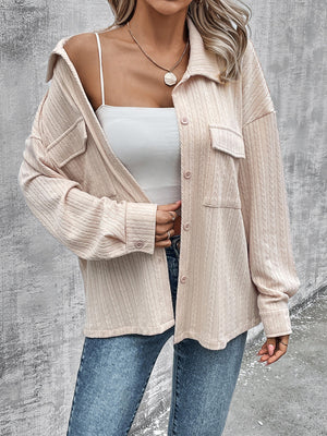 Beige textured overshirt with relaxed fit, button front, and chest pockets.