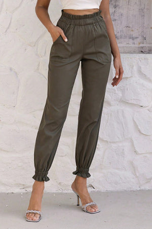 Olive brown cuffed jogger trousers with gathered elastic waistband and ruffle ankles.