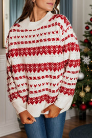 Fair Isle knit crewneck pullover sweater in white with red pattern, long sleeves, and ribbed cuffs and hem.