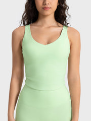 Light green ruched tank top with V-neck and athletic fit