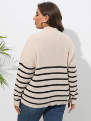 Beige ribbed knit sweater with black horizontal stripes and band collar.