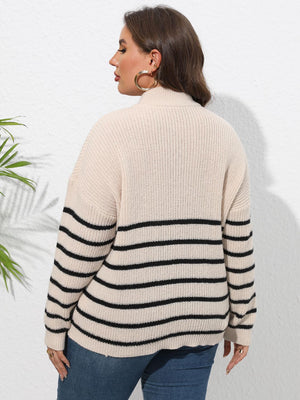 Beige ribbed knit sweater with black horizontal stripes and band collar.