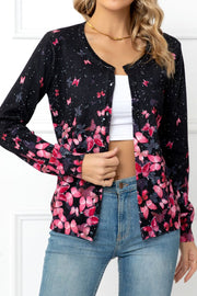 Black botanical print crewneck cardigan with pink butterflies and flowers, buttoned front.