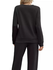 Black casual long-sleeve top and pants set with drawstring detail.