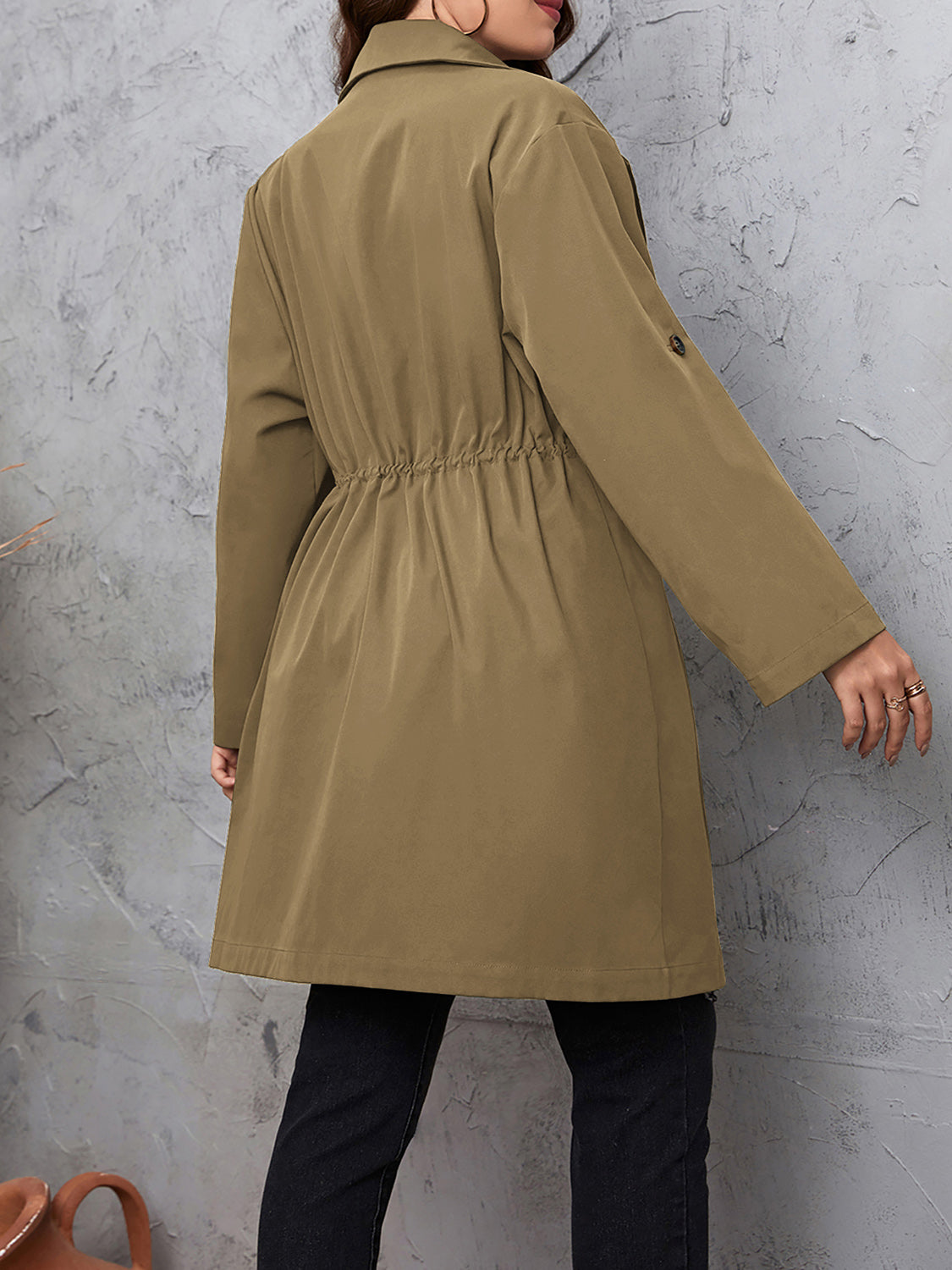 Trench coat in mocha with gathered waistline and roll-tab sleeves.