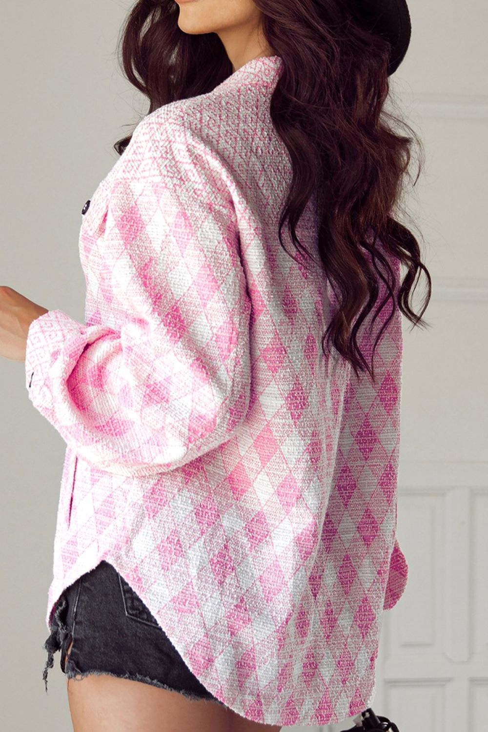 Pink diamond weave shacket with puff sleeves and buttoned front.