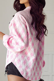 Pink diamond weave shacket with puff sleeves and buttoned front.