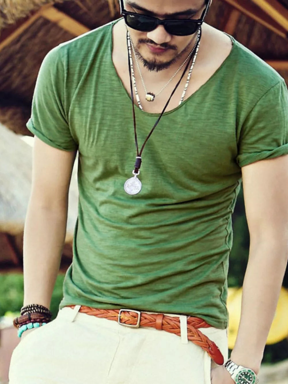 Men's Grass Green relaxed scoop neck cotton tee with rolled sleeves.