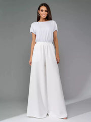 White wide-leg jumpsuit with shimmering sequin top and tie waist.
