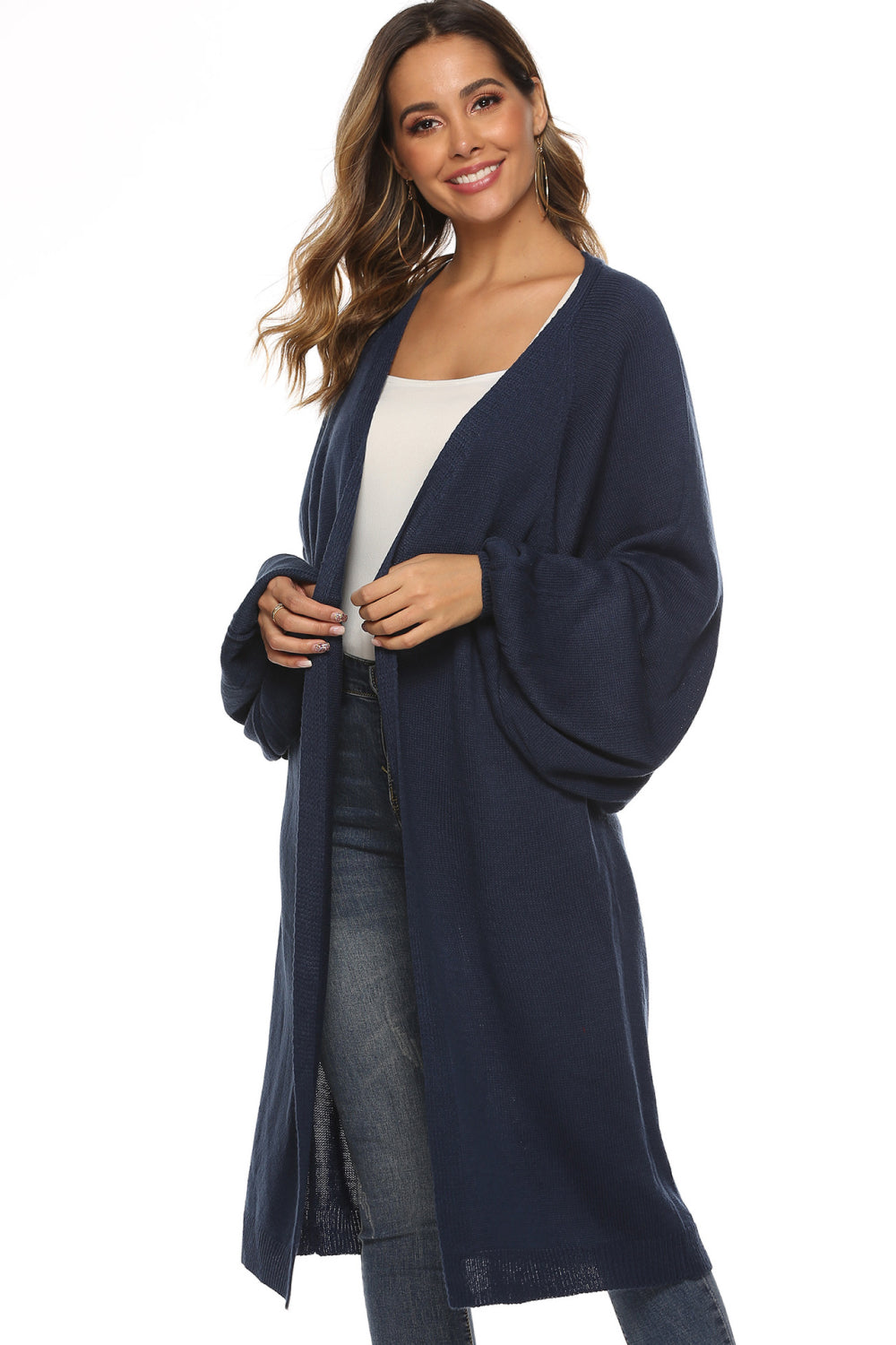 Dark blue oversized sleeve maxi knit cardigan with open front and side slits.