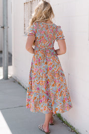 Floral smocked bodice tiered midi dress with short flutter sleeves and keyhole back.