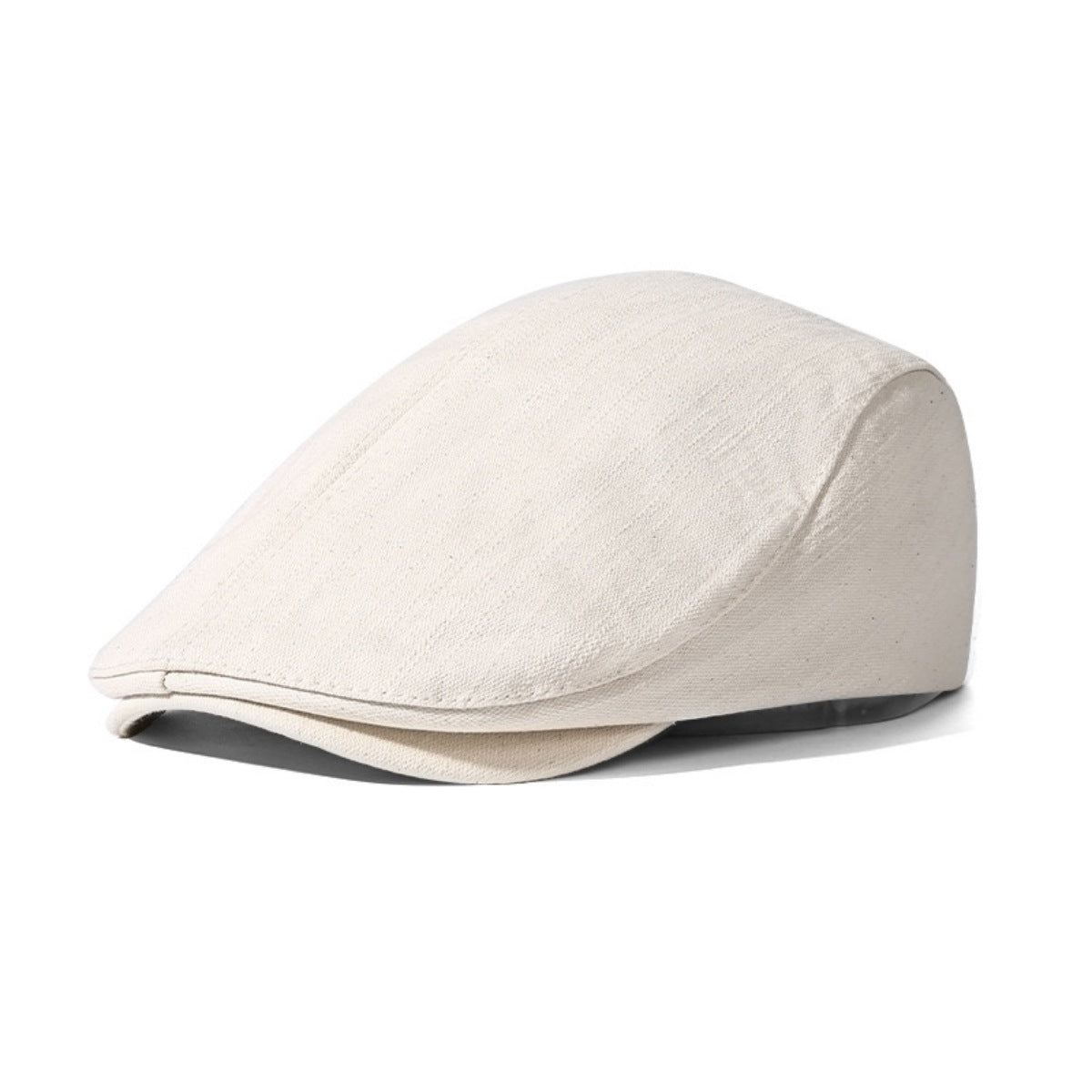 White cotton newsboy cap with a subtle textured weave and a classic flat cap silhouette.