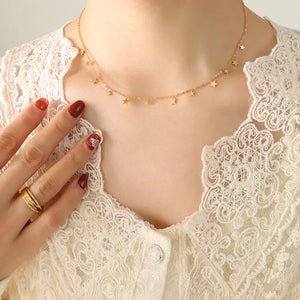 Gold star charm chain necklace with delicate dangling stars