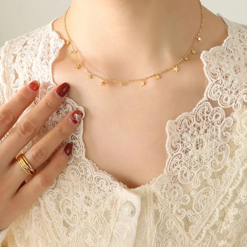 Gold star charm chain necklace with delicate dangling stars