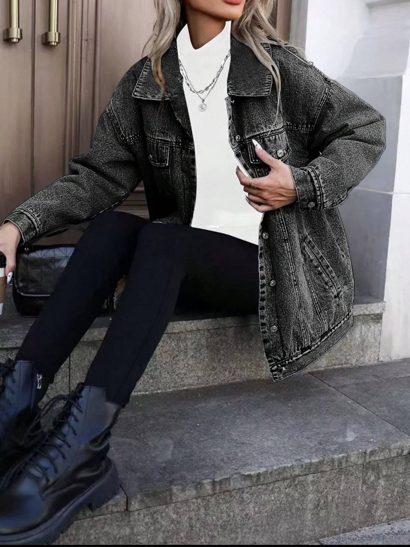 Oversized washed grey denim jacket with button front and chest pockets, styled with a white turtleneck.