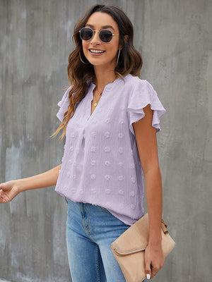 Lavender textured voile blouse with flutter sleeves and a v-neckline.