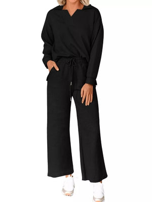 Black V-neck textured lounge set with drawstring pants and long sleeves.