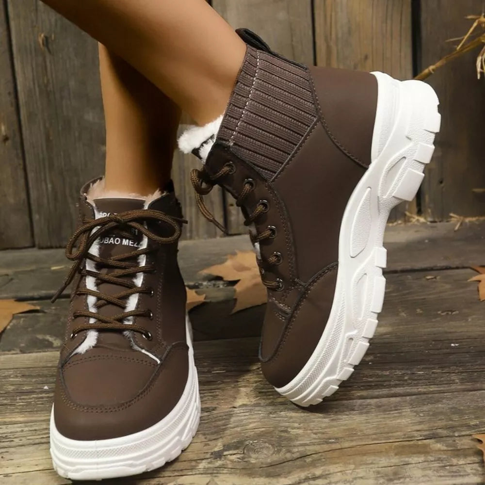 Chocolate lace-up boots with plush accents and knit cuff detail.