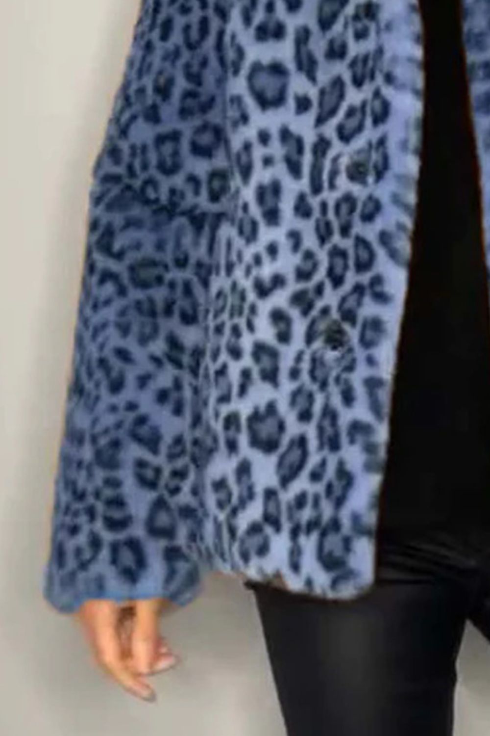 Blue leopard print faux fur coat with a relaxed fit.