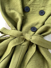 Green V-neck wide leg jumpsuit with tie belt and button detail