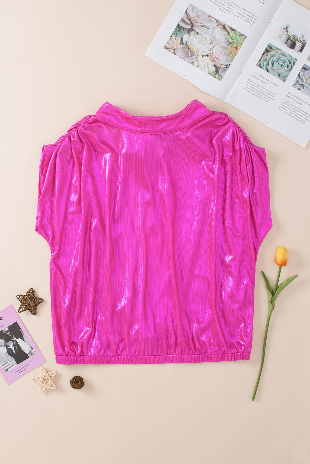 Hot pink metallic blouse with cap sleeves and draped back detail.