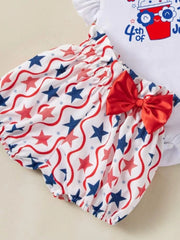 Baby outfit set with red, white, and blue star pattern bloomers and a red bow.