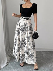 Chic floral maxi dress with square neckline, black top, white skirt with black floral print.