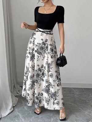 Chic floral maxi dress with square neckline, black top, white skirt with black floral print.