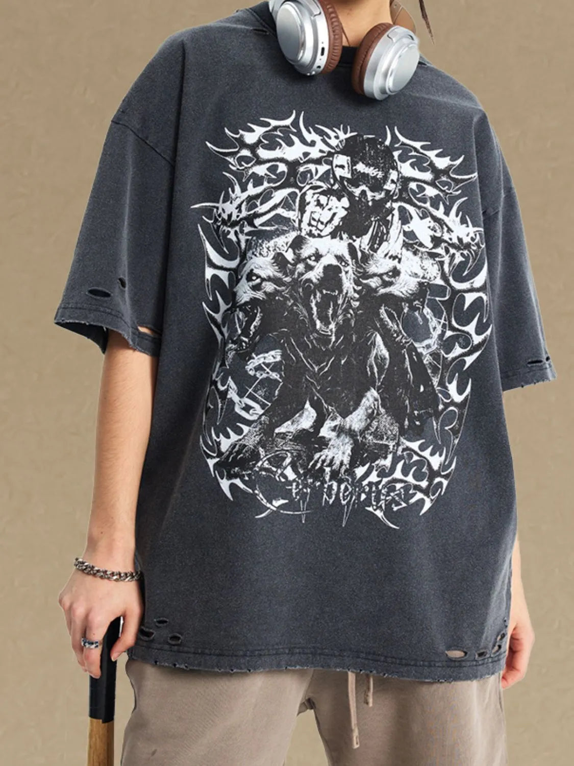 Black distressed oversized graphic t-shirt with ripped details and a bold wolf and skull print.
