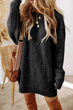 Black cable knit sweater dress with diamond pattern and ribbed trim.
