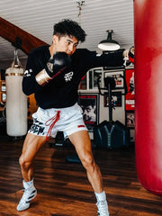 Kill Crew graphic training shorts in white with red drawstring, worn by a boxer.