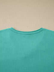 Mineral wash teal cotton maternity t-shirt with crew neck and short sleeves.