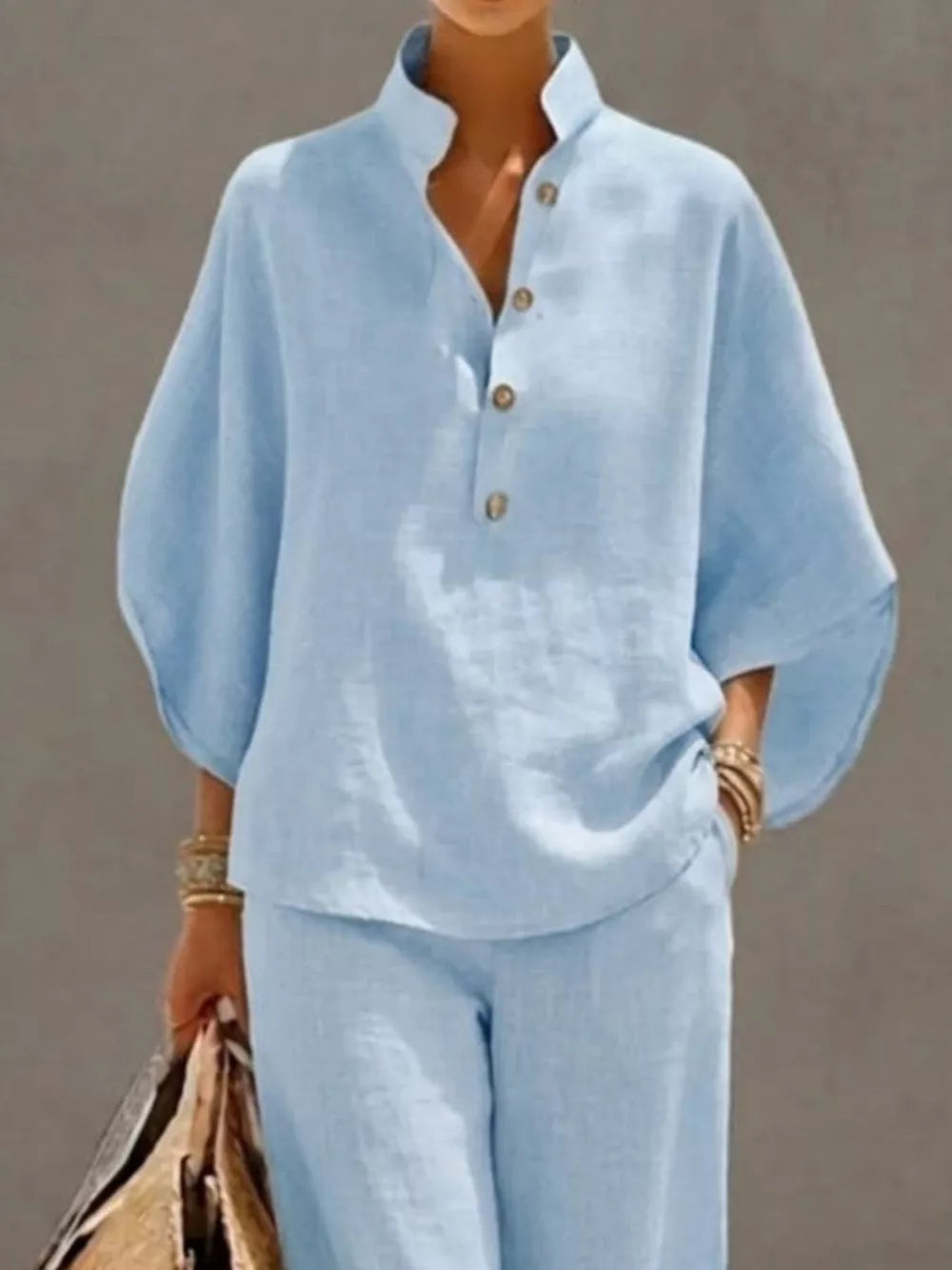 Sky blue buttoned loungewear set with a stand collar and relaxed fit top.