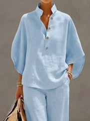 Sky blue buttoned loungewear set with a stand collar and relaxed fit top.