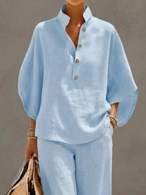 Sky blue buttoned loungewear set with a stand collar and relaxed fit top.