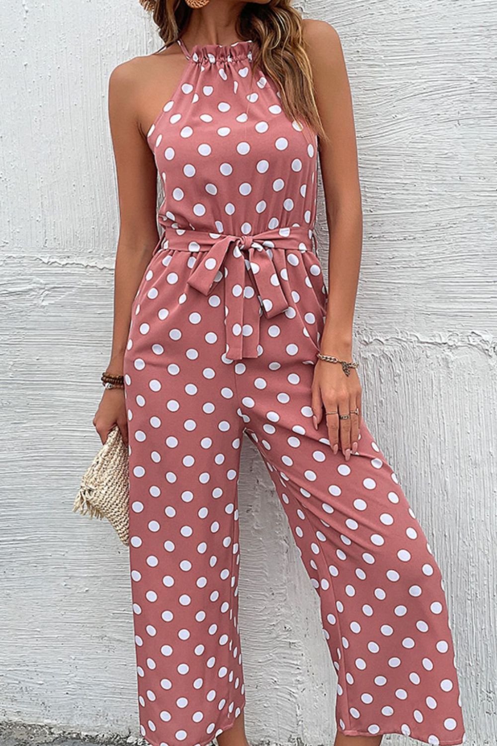 Pink polka dot halter neck palazzo jumpsuit with tie belt
